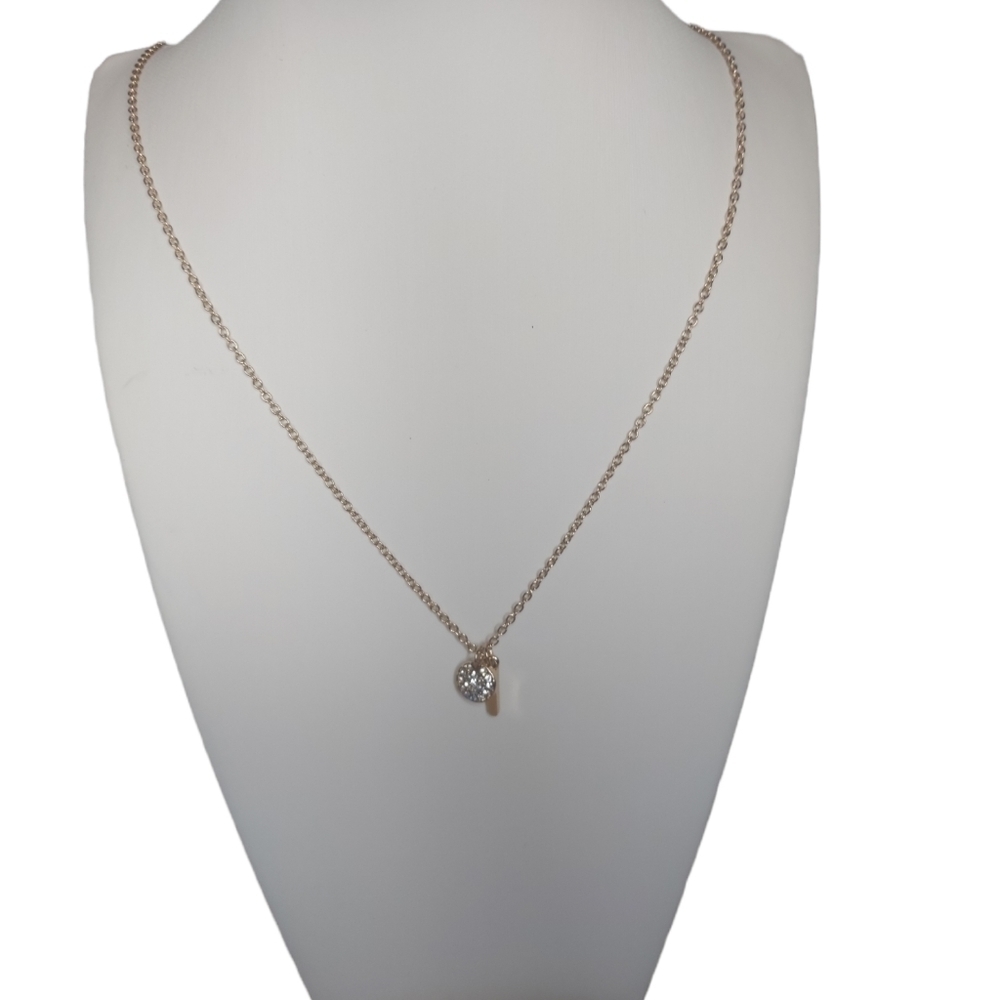 Dainty necklace with a small pendant. Gold costume jewelry